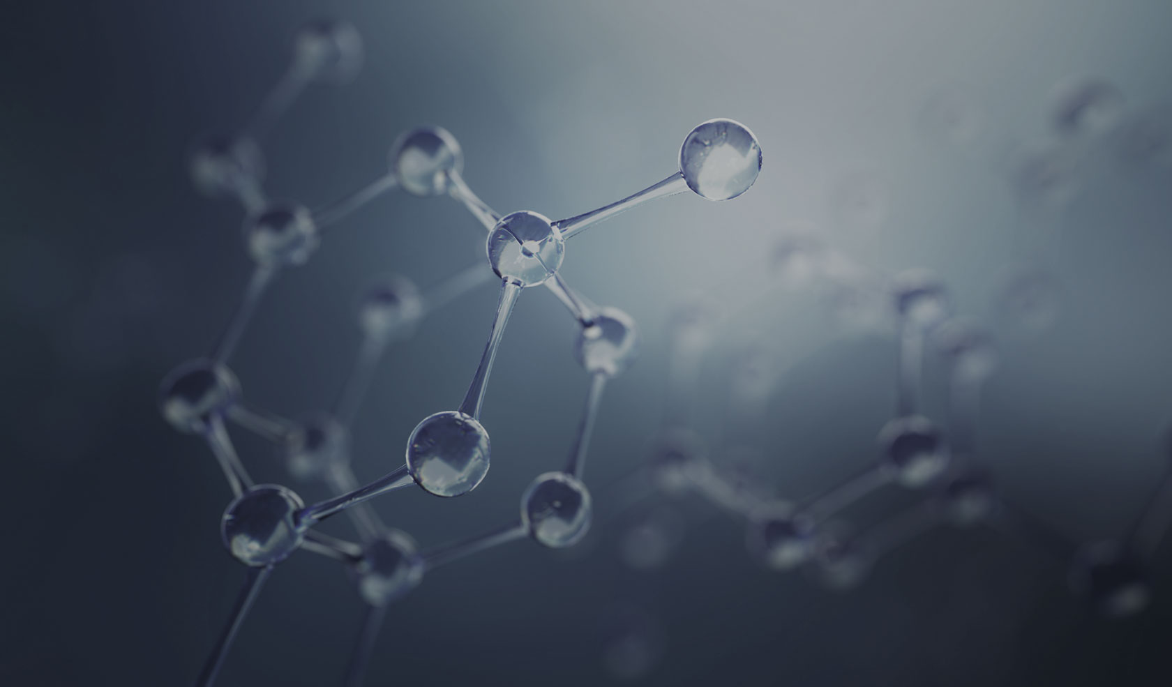 glass stick and ball model of chemical compound on blue-gray background