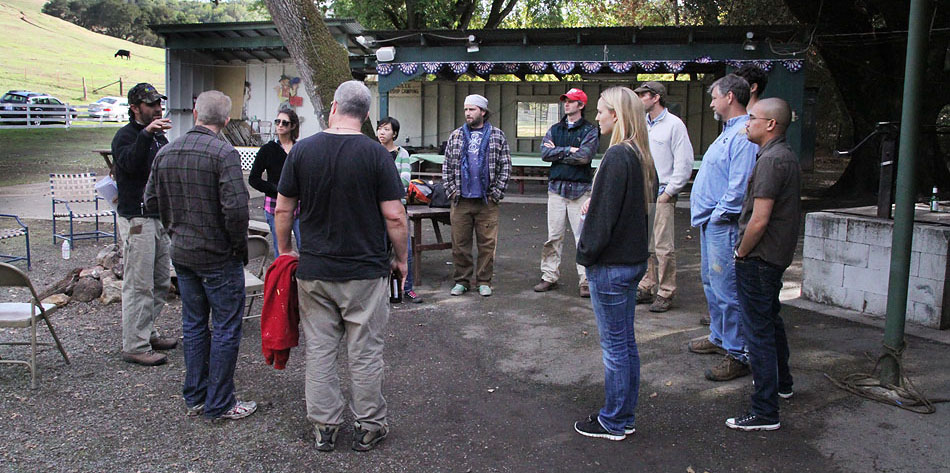 People standing in a circle outside