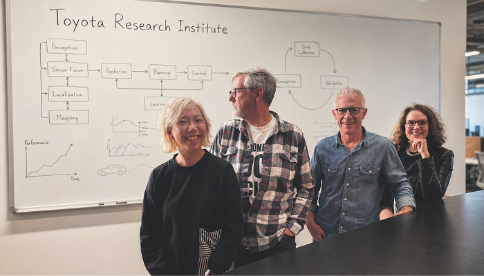 Team of people in front of whiteboard