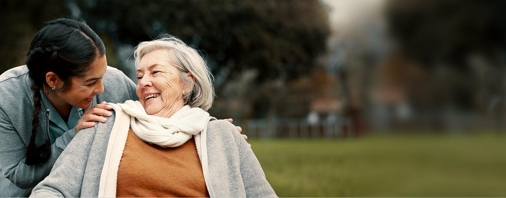 caregiver with patient outside in garden