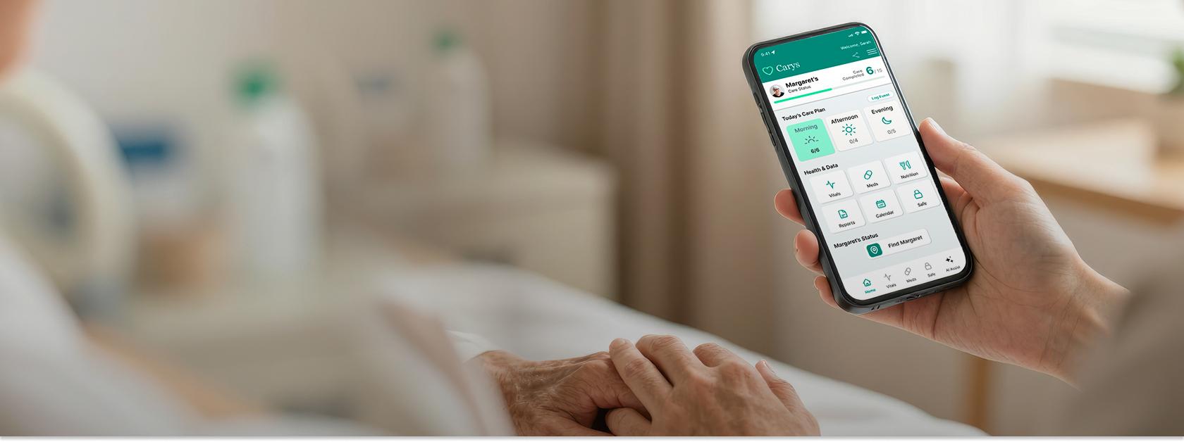 caregiver holding hand and a phone with app showing